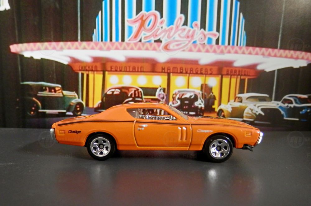 Diecast Dodge Charger modelcar, Hot Wheels 1:64 in orange owned by 'Fred'